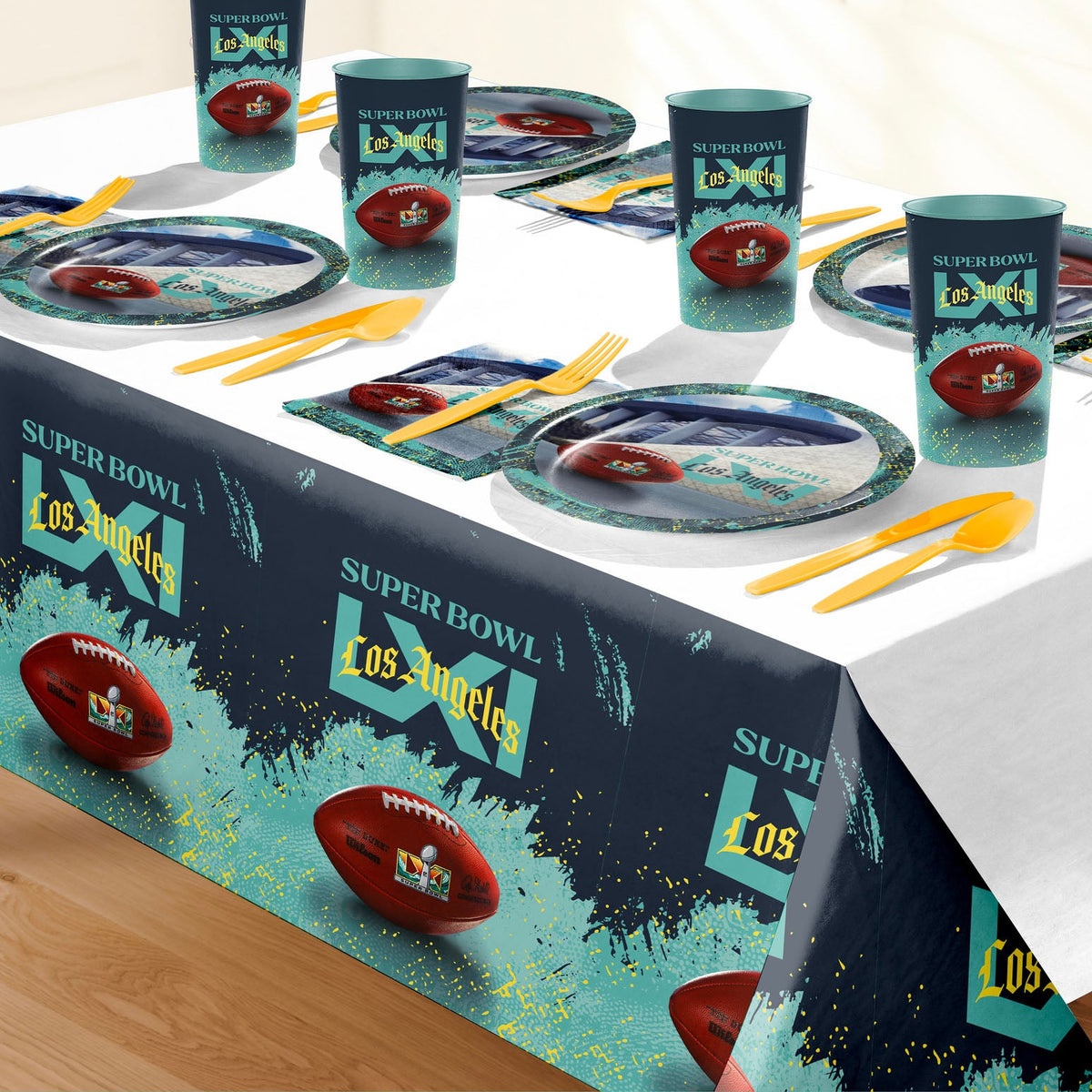 NFL Super Bowl LXI themed party table setting with a printed tablecloth, matching plates, cups, and utensils. 