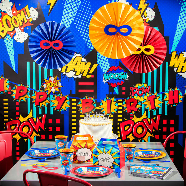 Superhero Slogans Party Supplies displayed on a table