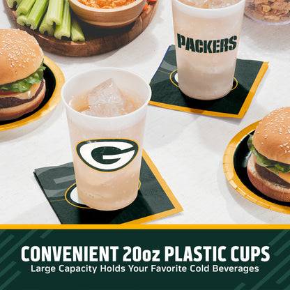 Green Bay Packers cups on a table with matching napkins and plates surrounded by food. "Convenient 20oz Plastic Cups" text is featured along the bottom.