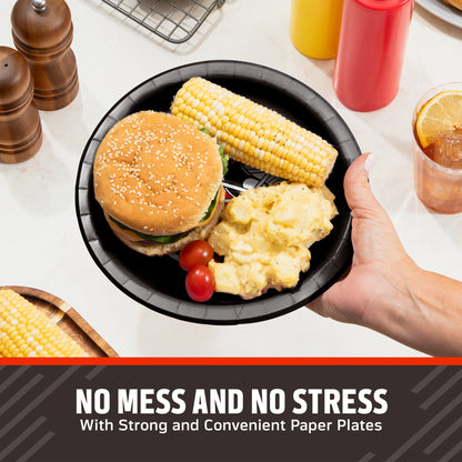 Hand holding a Cleveland Browns plate filled with a hamburger, corn on the cob, and potato salad. Banner with "No Mess and No Stress" text along the bottom