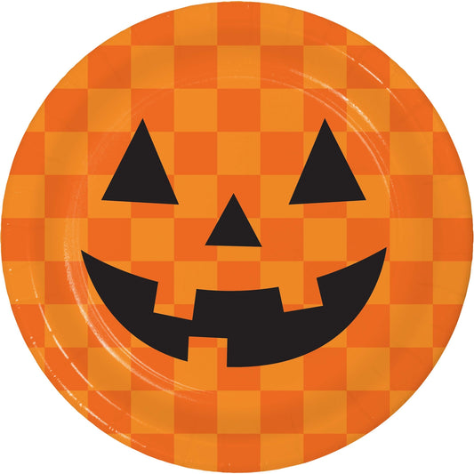 Retro Halloween Jack-O-Lantern Dessert Paper Plates 96 ct. Halloween-themed paper plate with jack-o'-lantern face on a checkered orange and yellow background