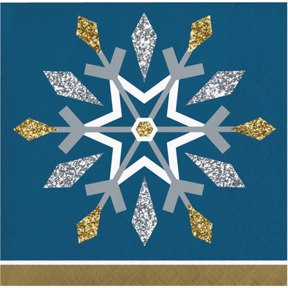 Decorative snowflake paper napkin with gold, silver, and white on a blue background