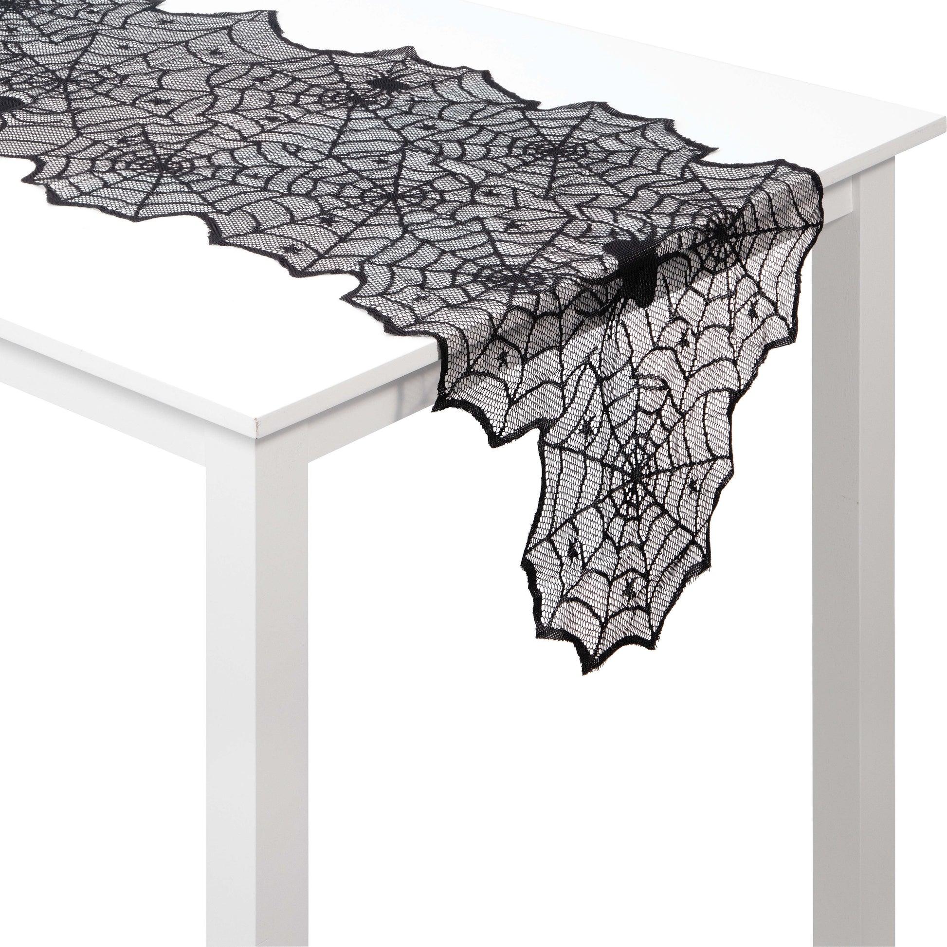 Black Lace Webs Table Runners 12 ct. Black lace spider web table runner on a white table