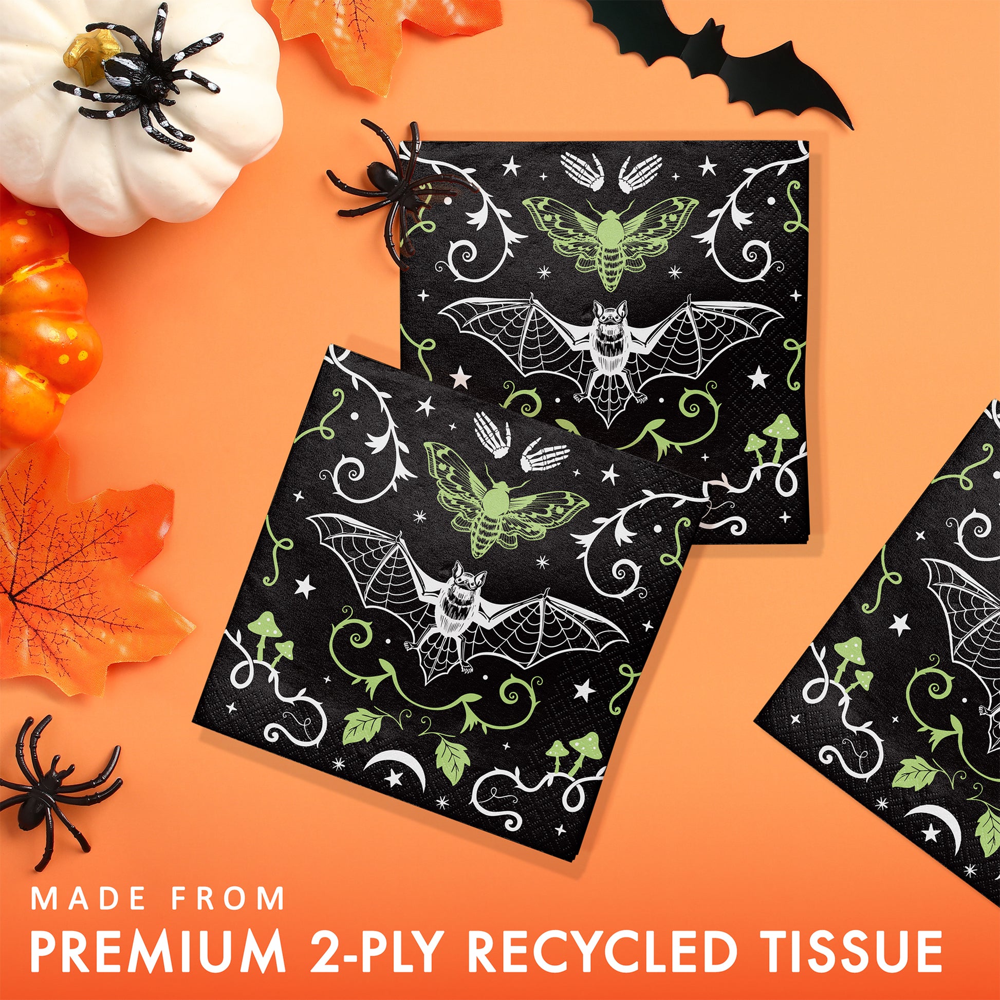 Halloween-themed 2-ply beverage napkins with bats and moths on a black background, surrounded by pumpkins and leaves on an orange background.