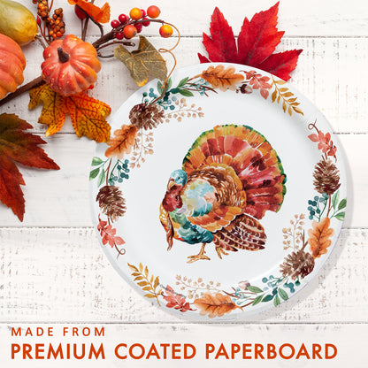 Tasteful Turkey Dessert Paper Plates 96 ct. Decorative paper plate with a turkey design surrounded by autumn leaves and pumpkins on a white wooden surface.