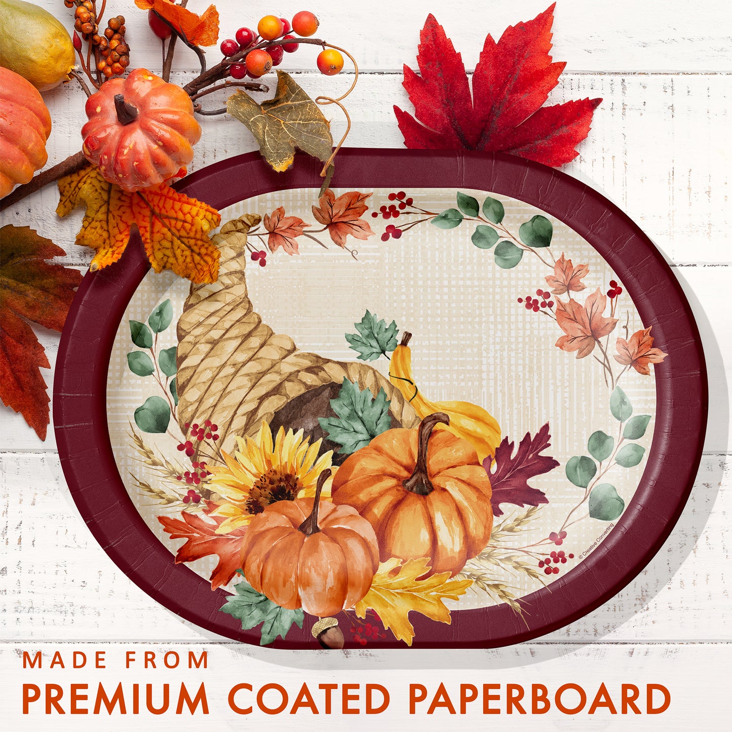 Fall Feast Oval Dinner Paper Plates 96 ct. Decorative paper plate with autumn design featuring pumpkins and leaves on a white background.