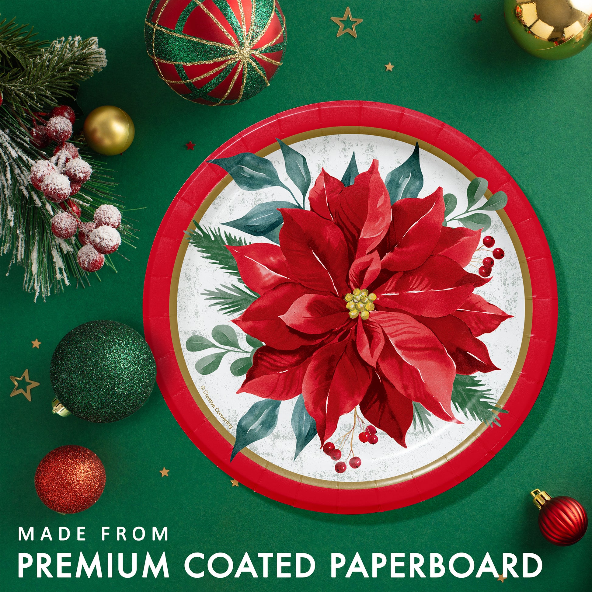 Festive Floral Dessert Paper Plates 96 ct. Decorative paper plate with poinsettia design on a green background with Christmas ornaments.