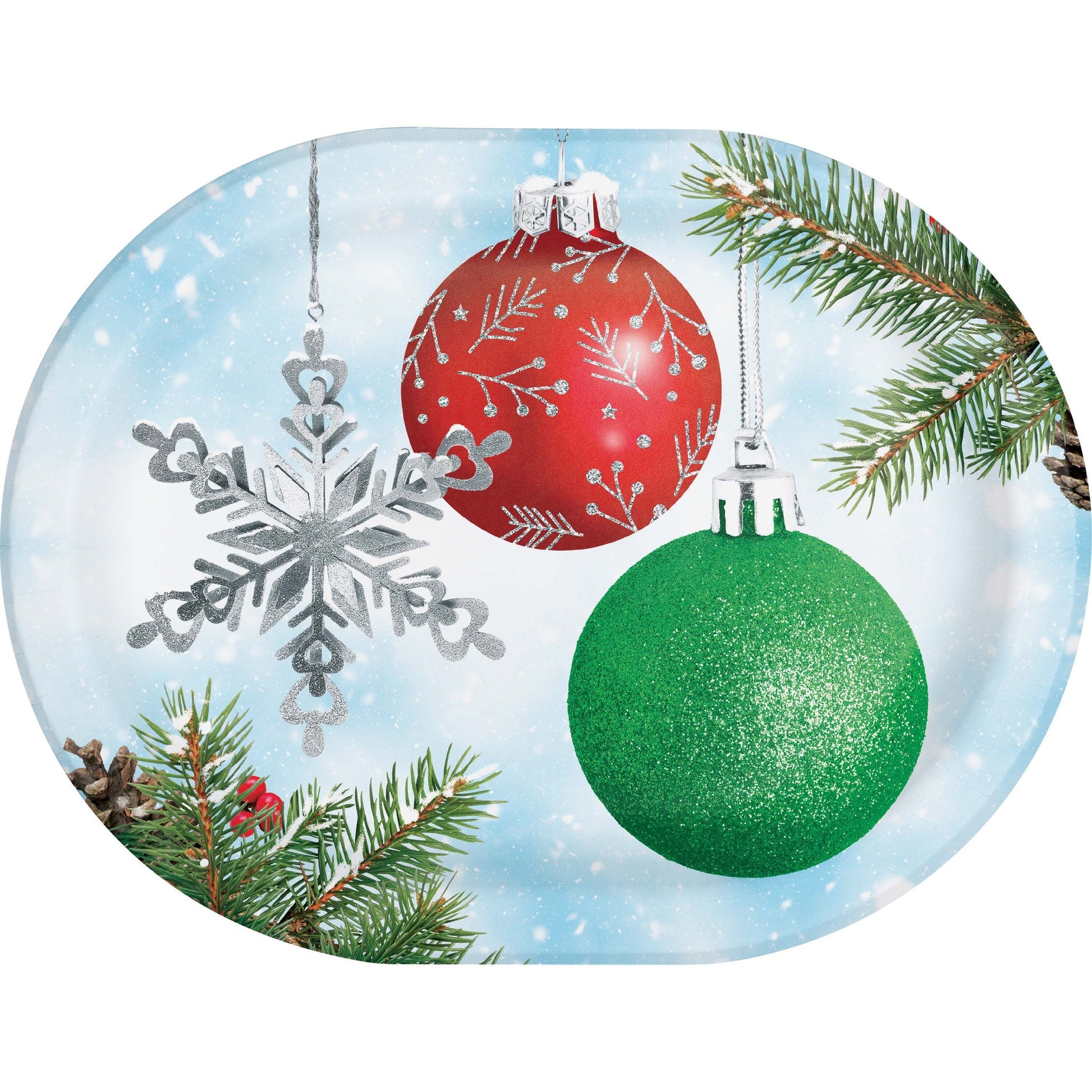 Decorative oval paper plate with Christmas ornaments including a red ball, green ball, silver snowflake, and pine branches on a snowy background.