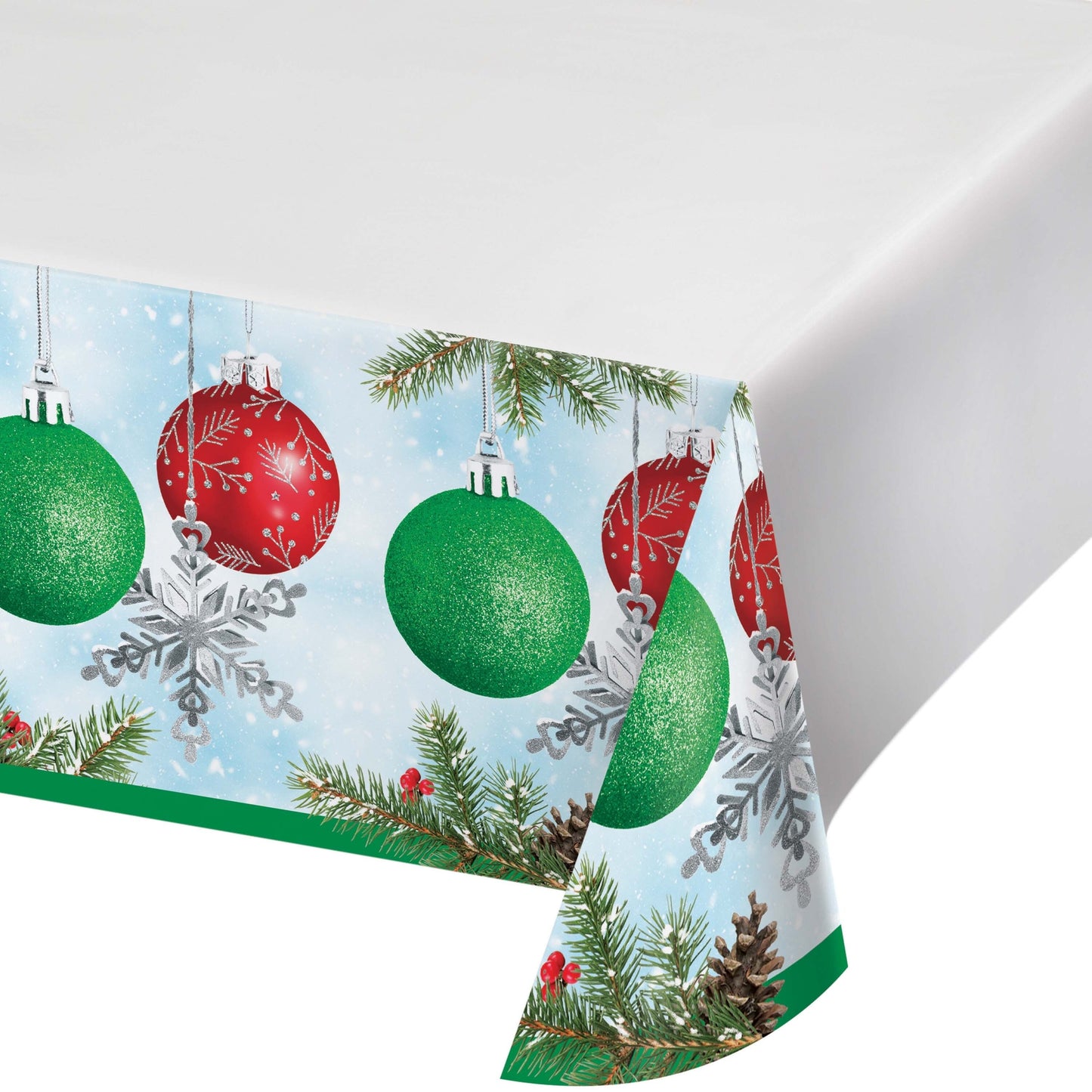 Christmas-themed paper tablecloth with ornaments, snowflakes, and evergreen branches on a white background.