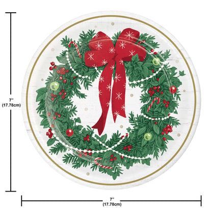 Round paper plate with Christmas wreath design featuring a red bow, greenery, and berries, with dimensions indicated.