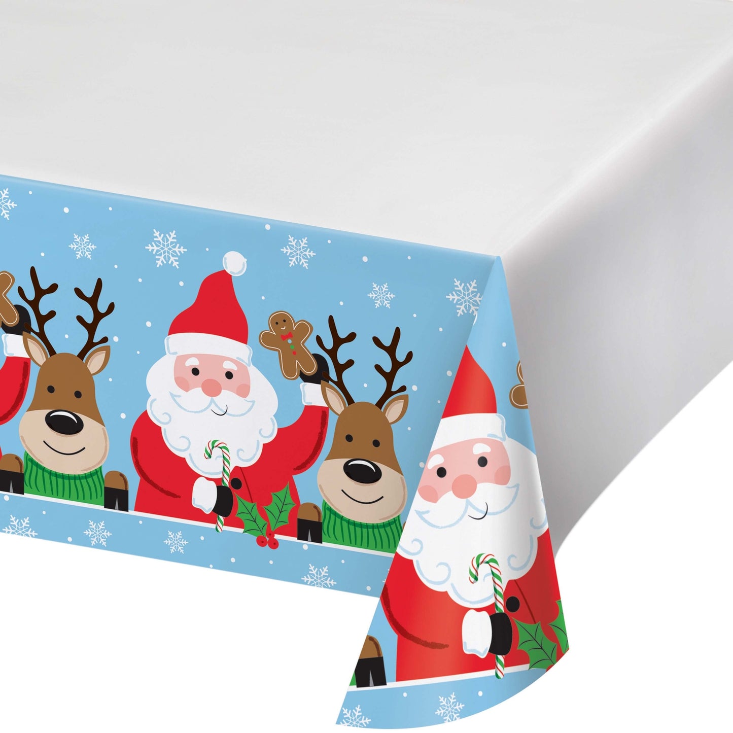Christmas-themed paper tablecloth with Santa Claus, reindeer, gingerbread bookies and candy canes on a blue background