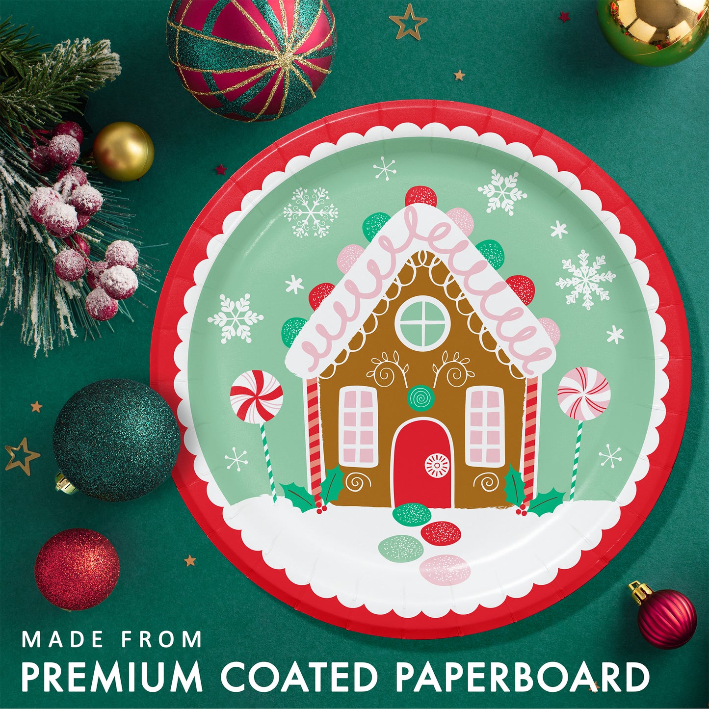 Christmas-themed paper plate with gingerbread house design. Plate shown on a green background with festive ornaments and greenery.
