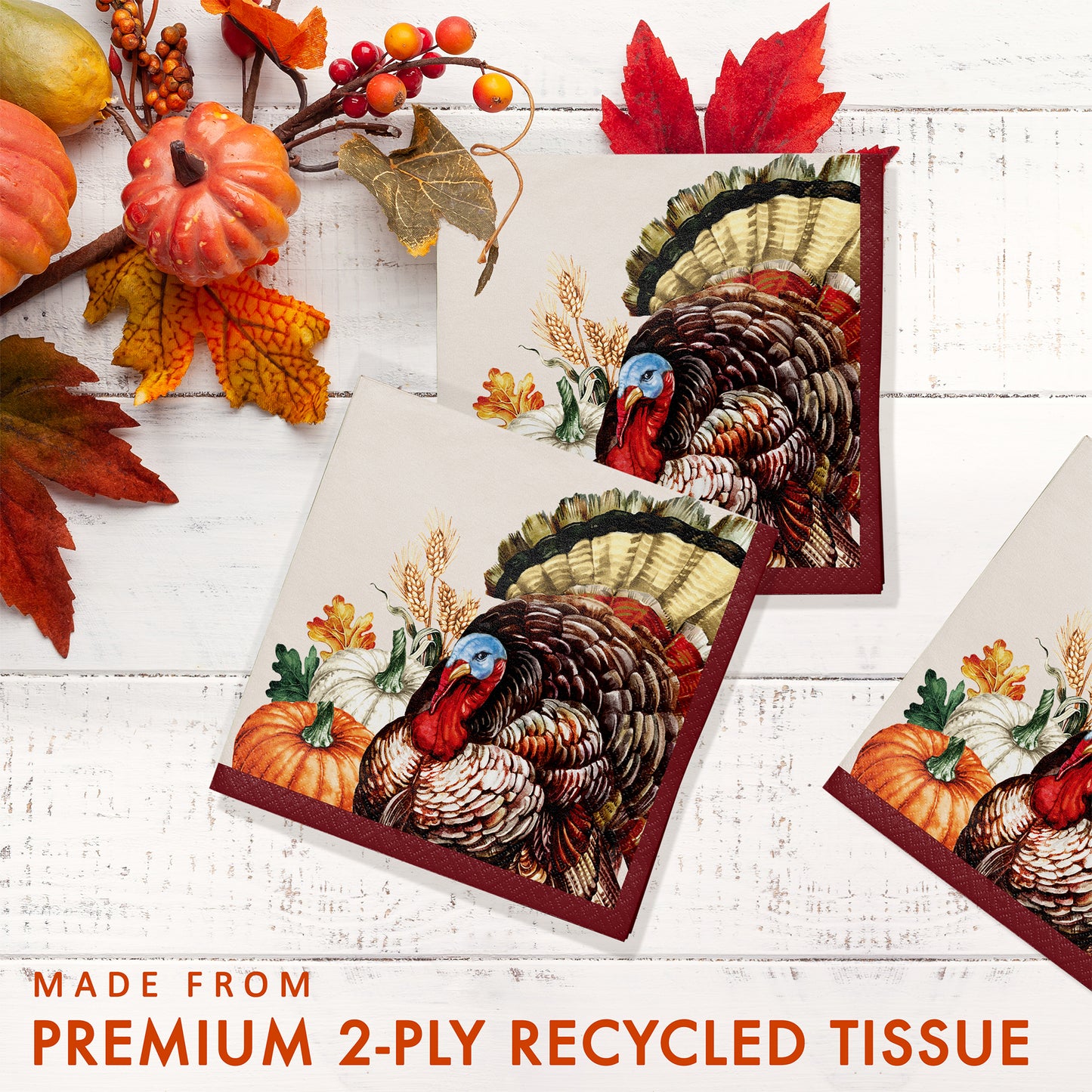 Vintage Turkey Beverage Napkins 192 ct. Recycled paper napkin with turkey design on a white wooden surface with autumn decorations.