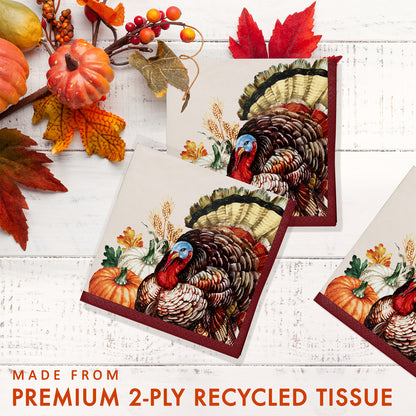 Vintage Turkey Beverage Napkins 192 ct. Recycled paper napkin with turkey design on a white wooden surface with autumn decorations.