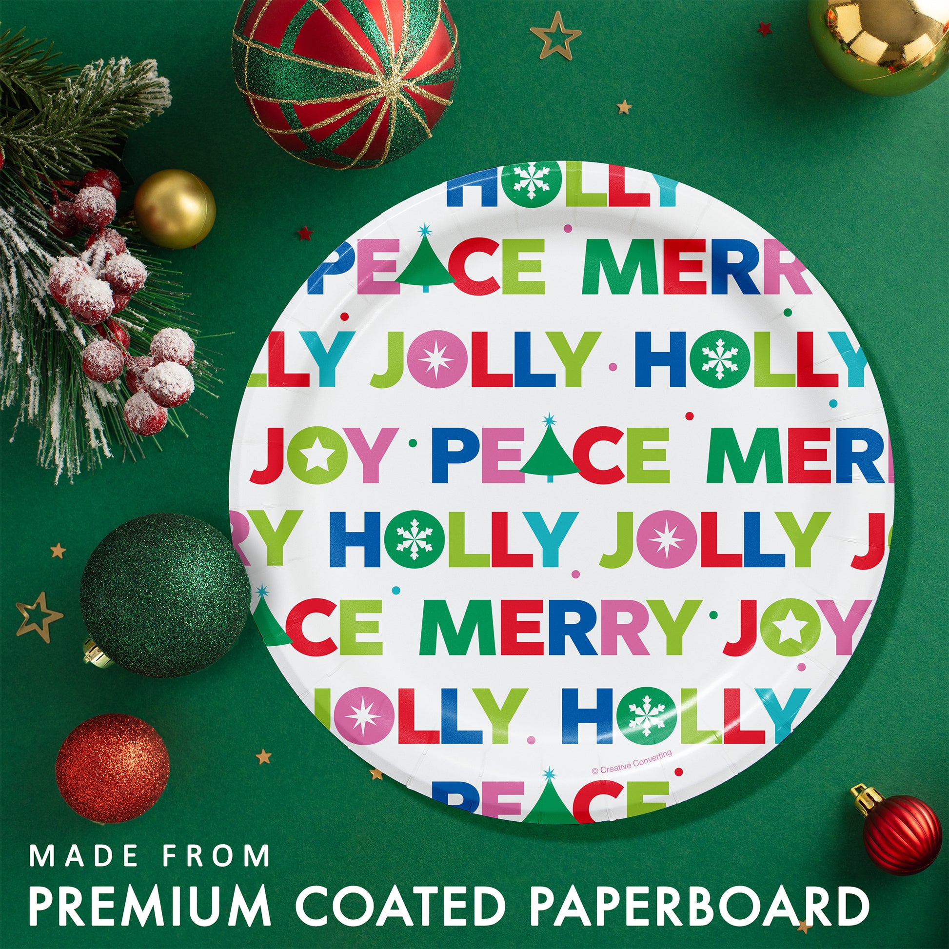 Joyful and Jolly Dessert Paper Plates 96 ct. Round paper plate with colorful Christmas text on a green background with festive decorations.