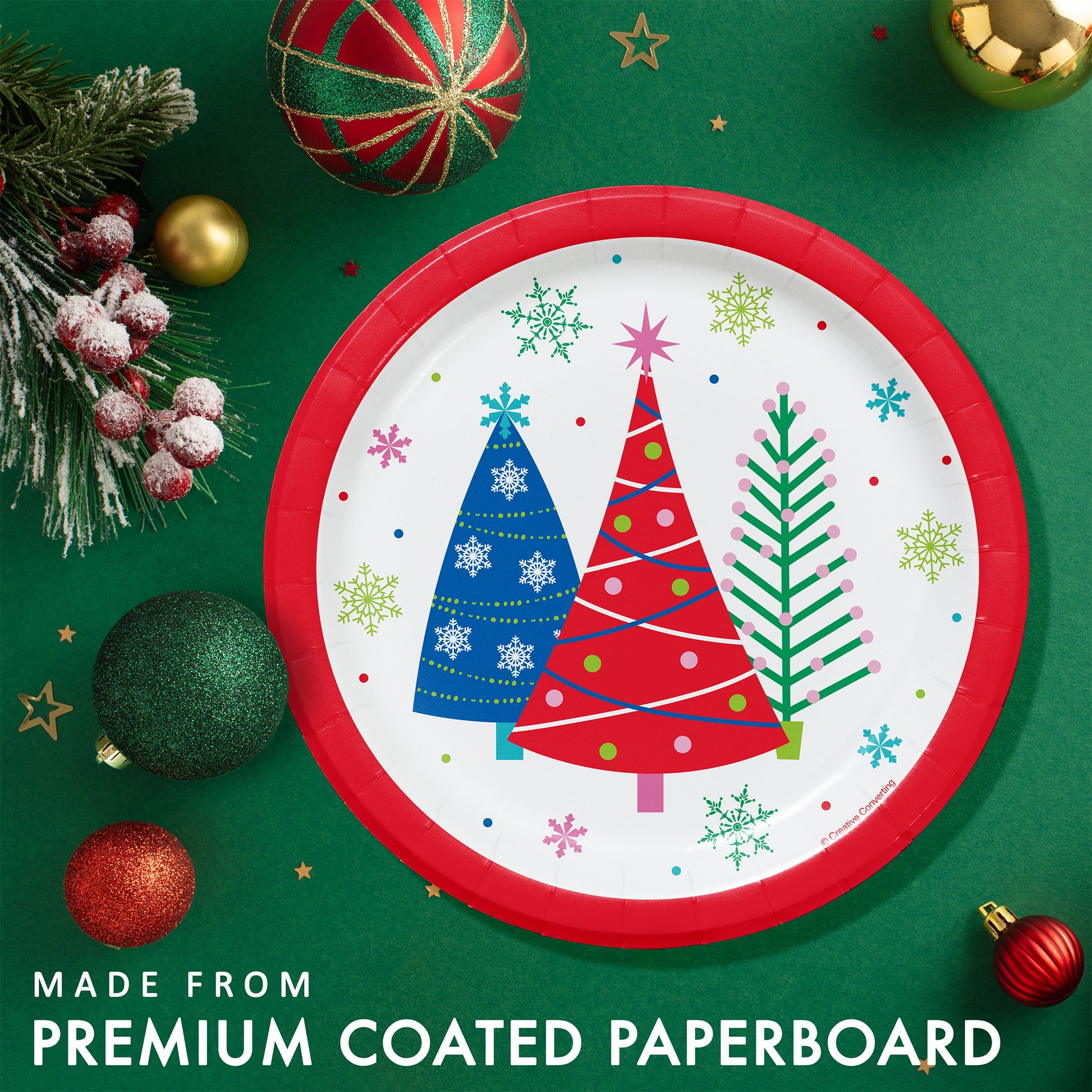 Joyful and Jolly Dessert Paper Plates 96 ct. Christmas-themed paper plate with colorful trees on a green background with festive decorations.