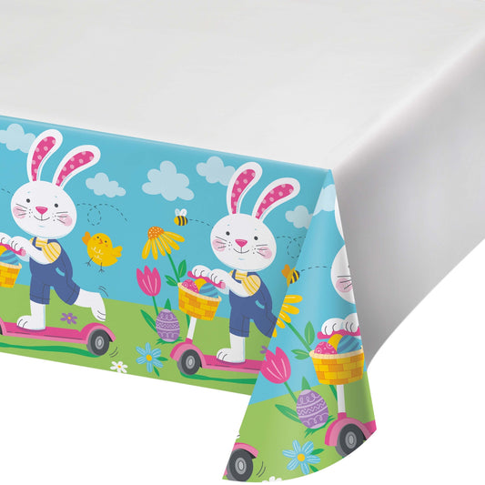 Colorful Easter-themed tablecloth with bunnies and flowers on a white background
