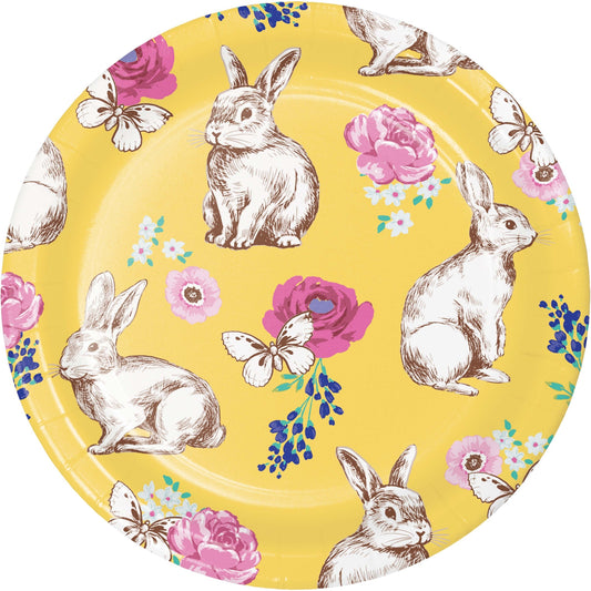 Round paper plate with rabbit and floral design on a yellow background