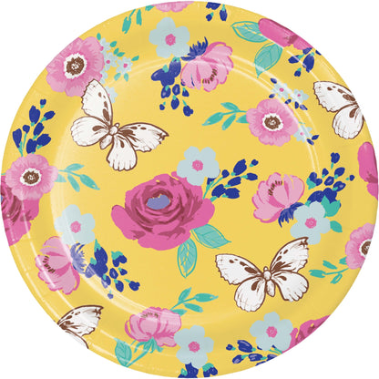 Round paper plate with floral and butterfly design on a yellow background