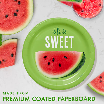 Green paper plate with watermelon slice and 'life is sweet' text, surrounded by watermelon slices on a white background.
