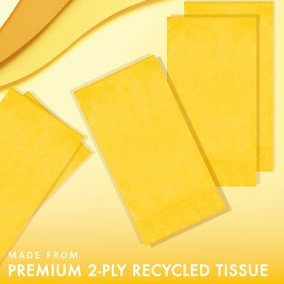 Yellow paper napkins on a yellow background with "Made from premium 2-ply recycled tissue" text