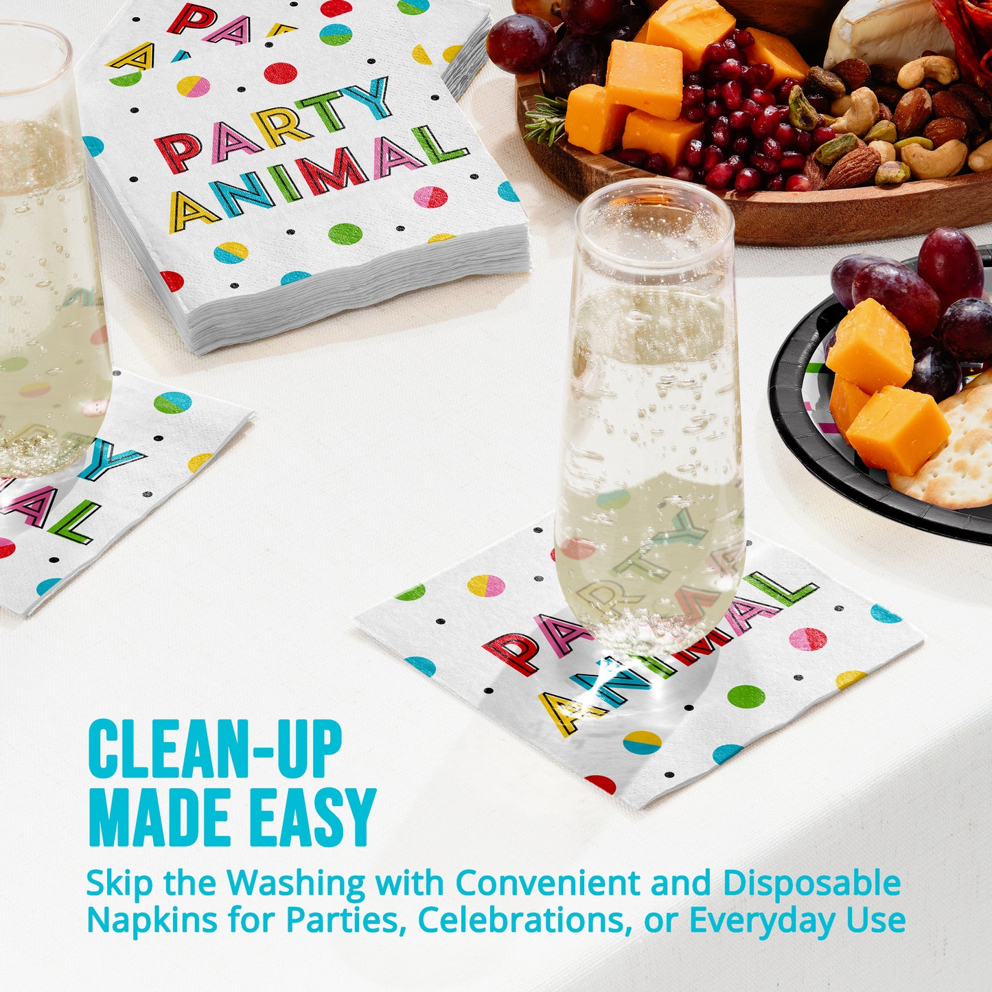 Disposable napkins with colorful text on a table with snacks and drinks.