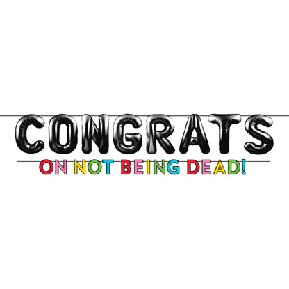 Birthday banner with 'CONGRATS ON NOT BEING DEAD!' on a white background