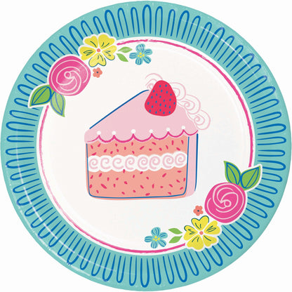 Decorative paper plate with a cake design and floral elements on a blue border.