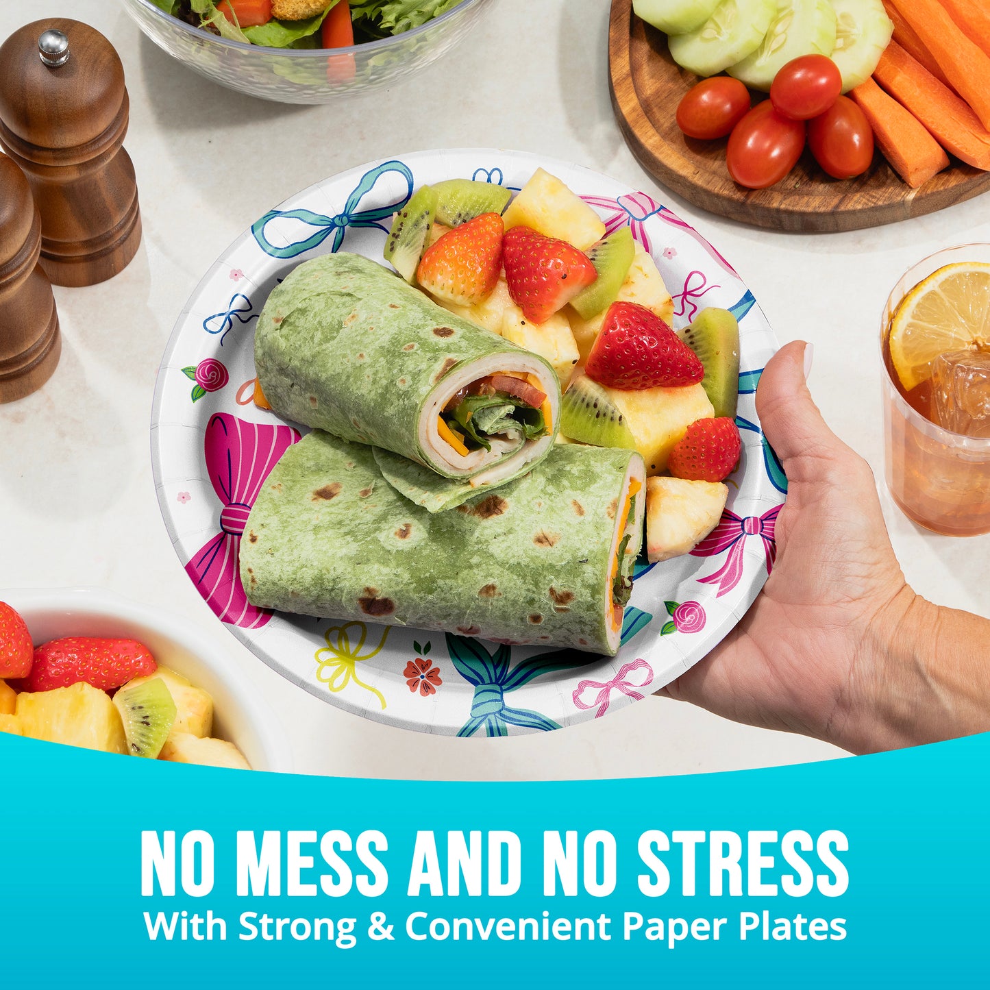 Paper plate with a wrap and fruit salad, surrounded by vegetables and a drink, with text 'No Mess and No Stress'.