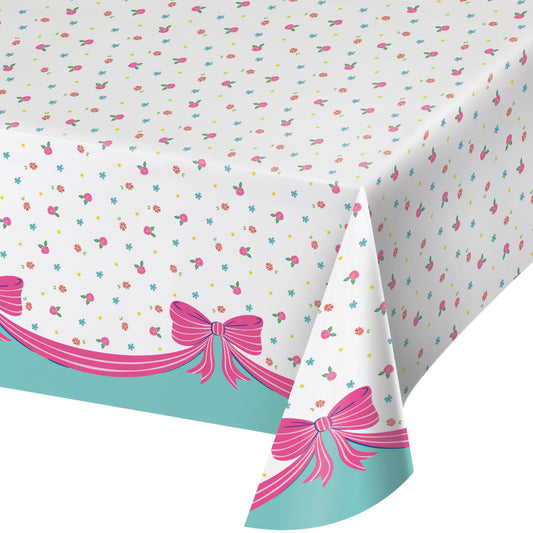 Tablecloth with pink bows and colorful polka dots on a white background