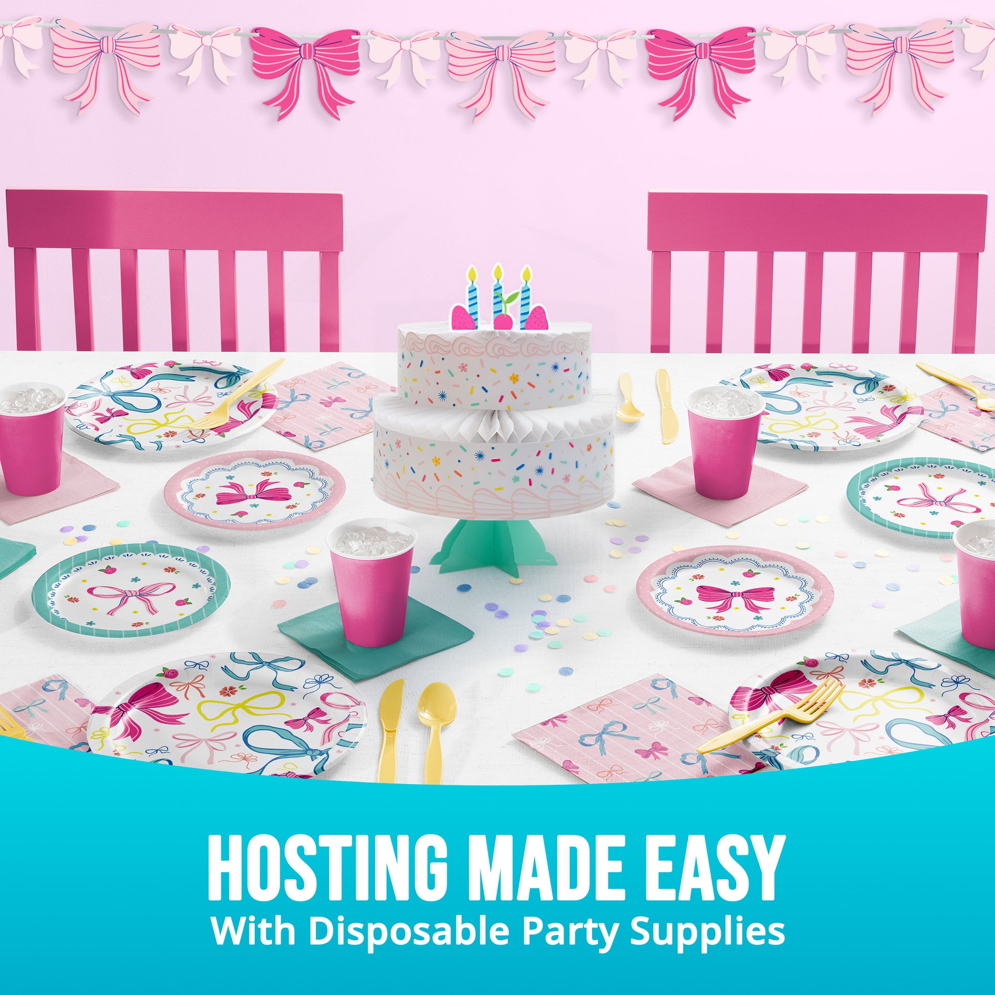 Disposable party supplies including a cake, plates, cups, and utensils on a table with pink chairs and decorative bows.