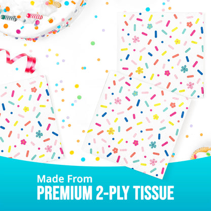 Colorful tissue paper napkin with sprinkles and flowers on a white background, labeled 'Made From Premium 2-Ply Tissue'.