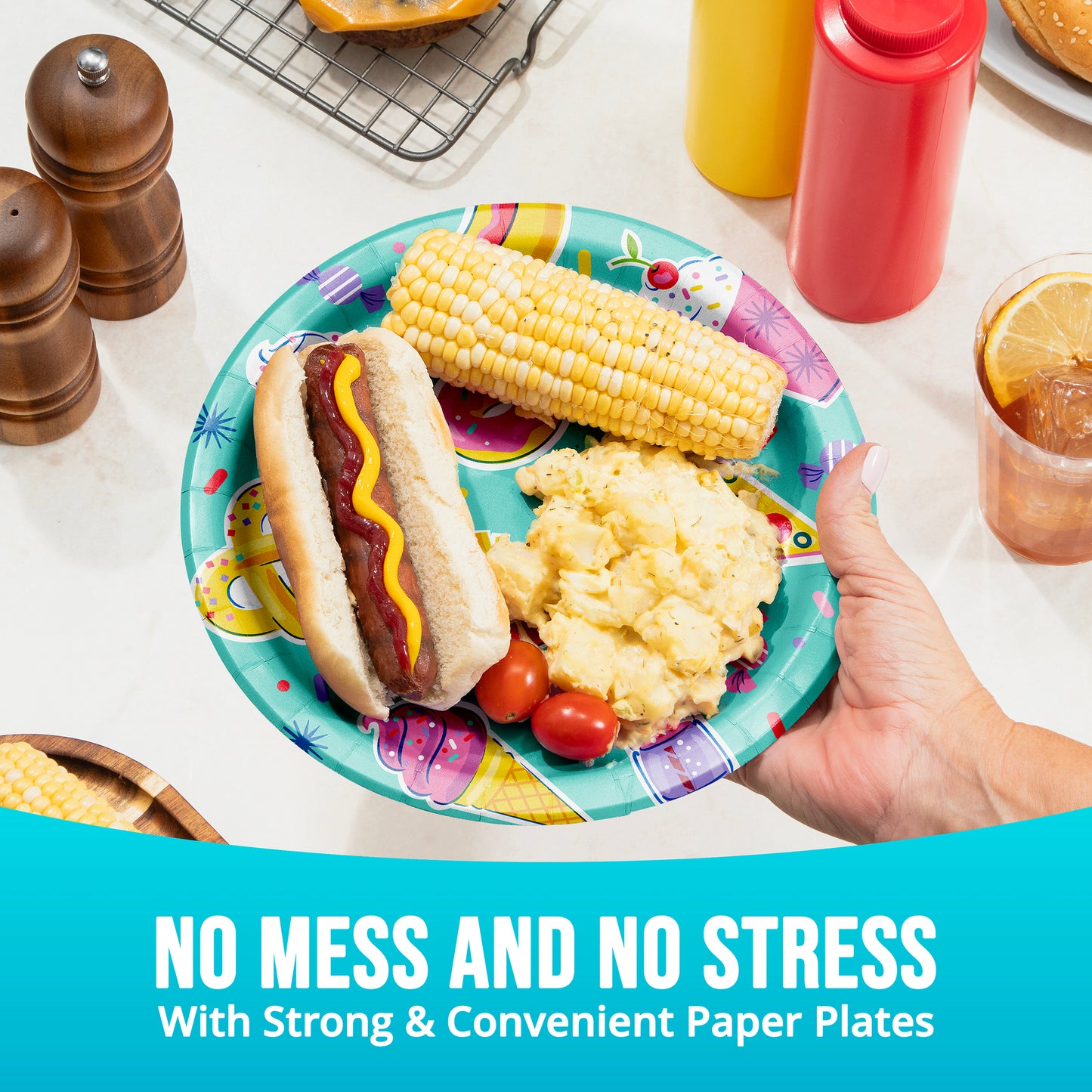 Colorful paper plate with hot dog, corn on the cob, and mashed potatoes held by a hand, with text 'No Mess and No Stress with Strong & Convenient Paper Plates'.