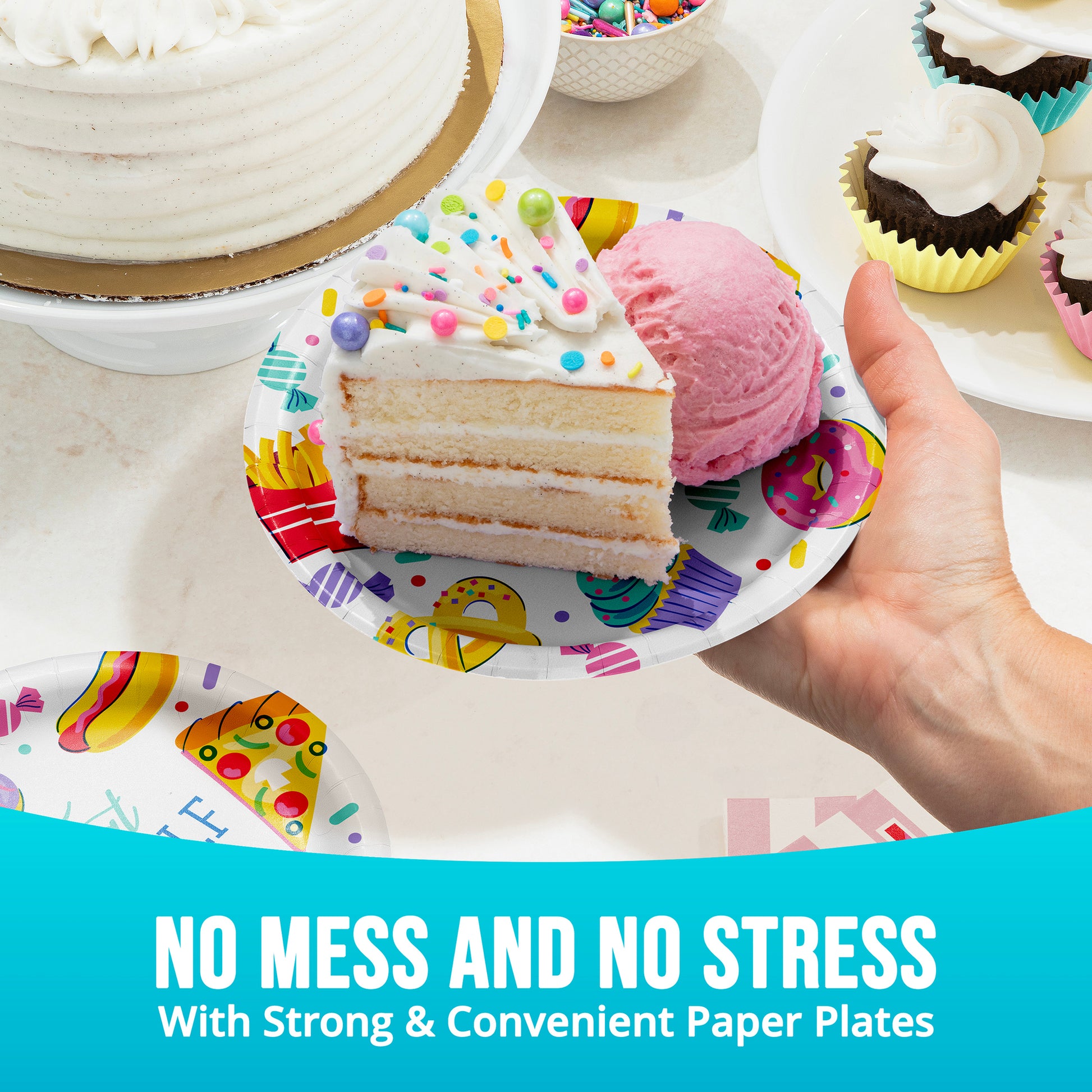 Hand holding a slice of cake on a colorful paper plate with ice cream, surrounded by more cakes and plates.