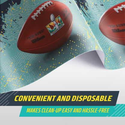 A close-up of a blue and grey Super Bowl LXI tablecloth shown with text overlays reading 'CONVENIENT AND DISPOSABLE' and 'MAKES CLEAN-UP EASY AND HASSLE-FREE'.