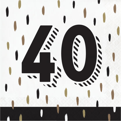 Napkin with the number 40 printed on it against a white background with black and gold confetti-like patterns.