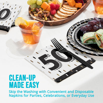 Disposable napkins with a number 50 design on a table setting with food and drinks.