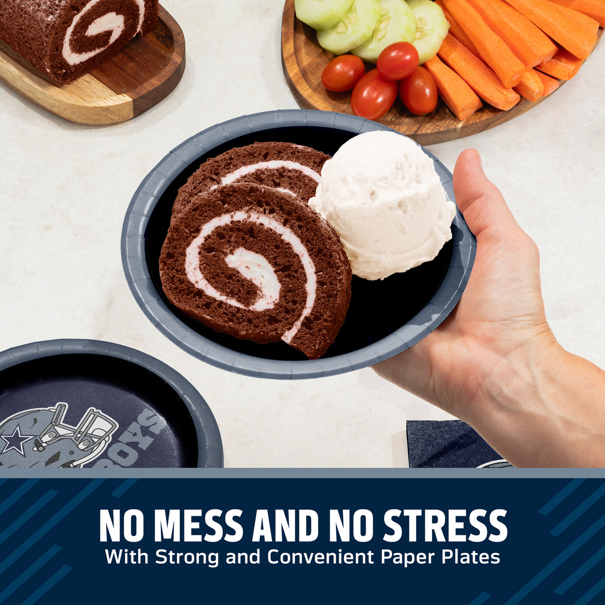 A hand holds a dark blue paper plate containing a slice of chocolate cake with cream swirl and a scoop of vanilla ice cream, with more paper plates and food props visible on a light countertop. A dark blue banner at the bottom reads, 'NO MESS AND NO STRESS With Strong and Convenient Paper Plates.