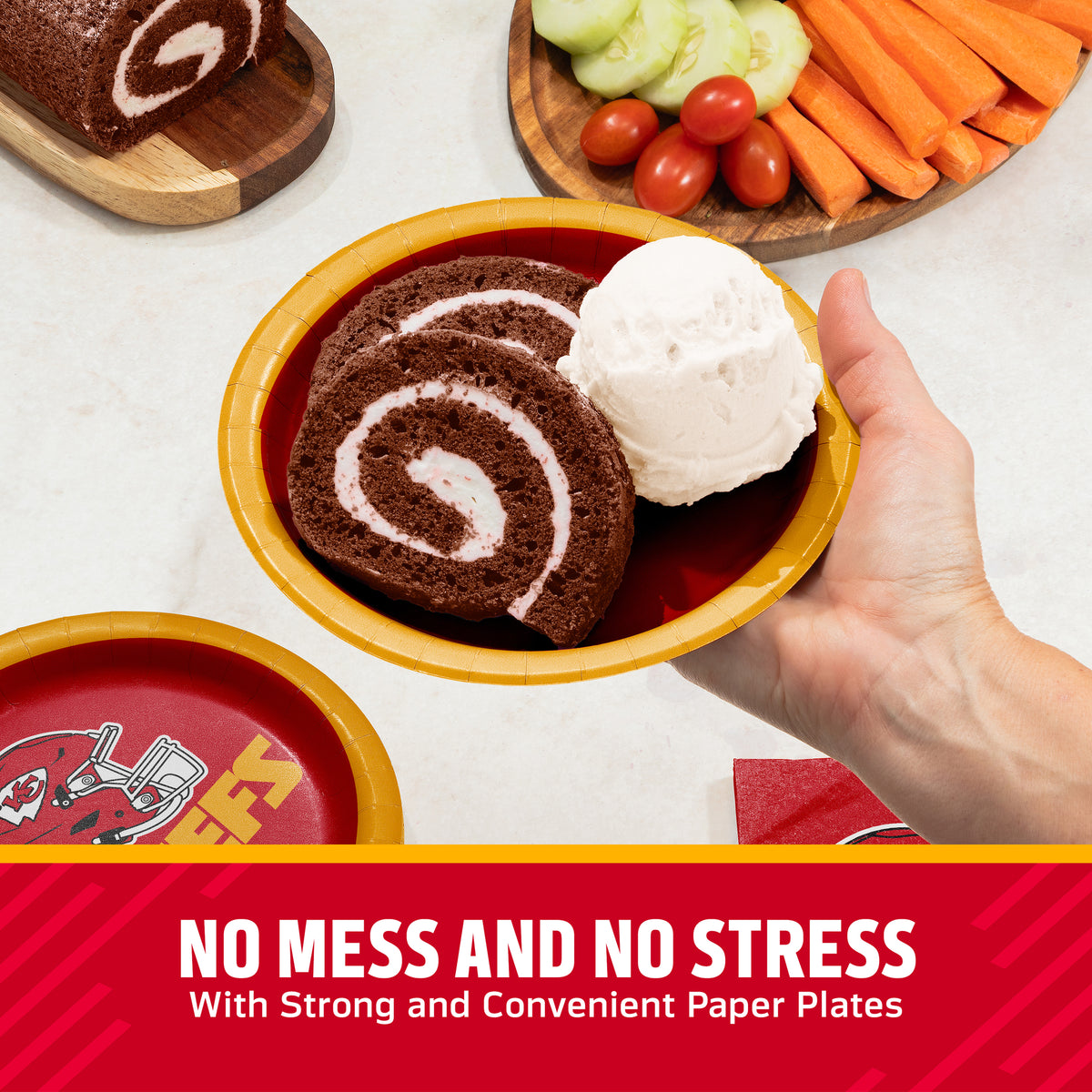 Hand holding a Kansas City Chiefs plate filled with chocolate cake and ice cream. Banner with "Clean-Up Made Easy" text along the bottom