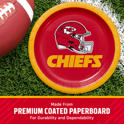 Kansas City Chiefs themed paper plate on a green turf background next to a football, with a text banner at the bottom reading 'Made from PREMIUM COATED PAPERBOARD'.