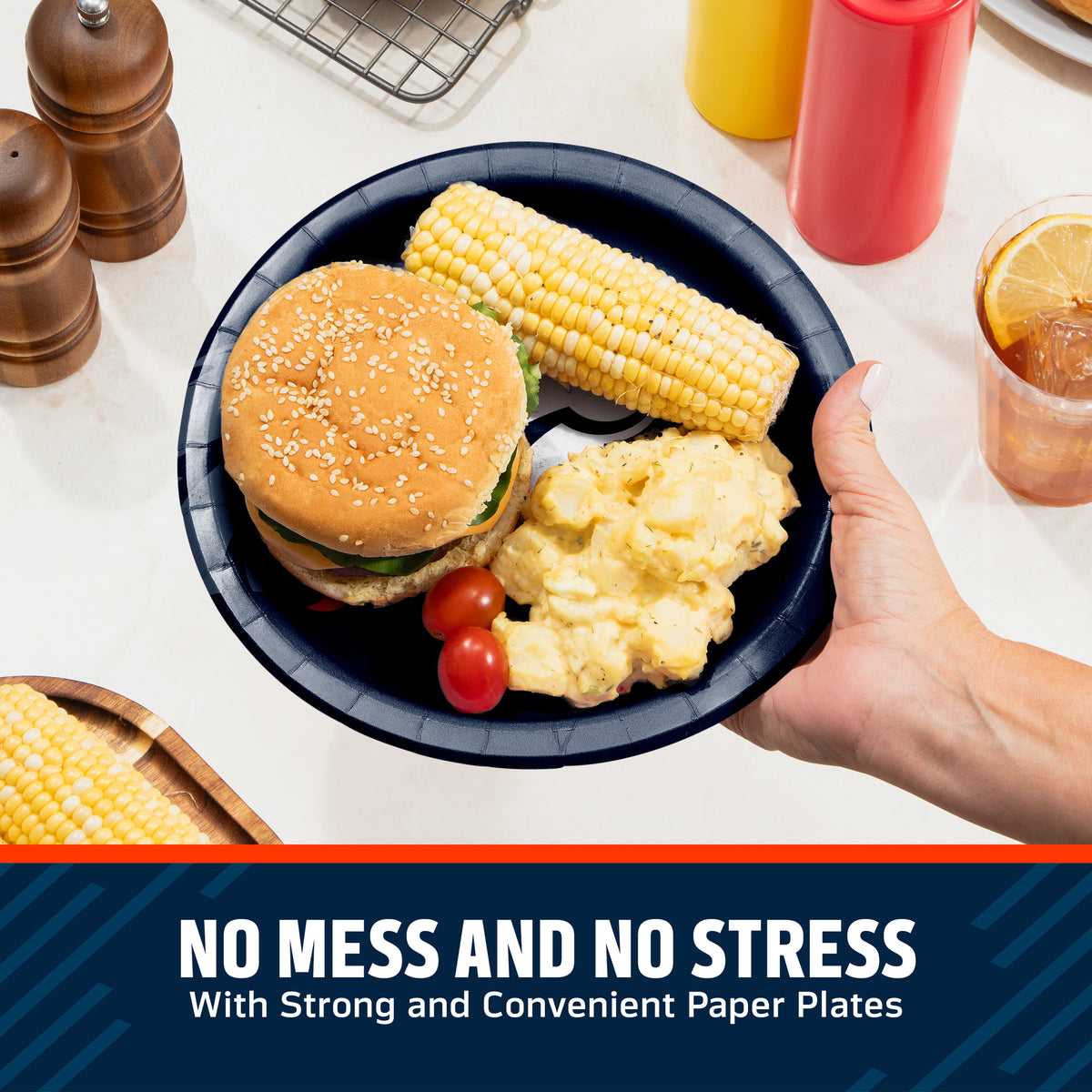 Hand holding a Denver Broncos plate filled with a hamburger, corn on the cob, and potato salad. Banner with "No Mess and No Stress" text along the bottom