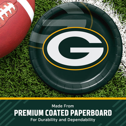 Green Bay Packers themed paper plate on a green turf background next to a football, with a text banner at the bottom reading 'Made from PREMIUM COATED PAPERBOARD'.