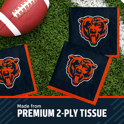 Three Chicago Bears themed square napkins on a green turf background next to a football, with a text banner at the bottom reading 'Made from PREMIUM 2-PLY TISSUE'.