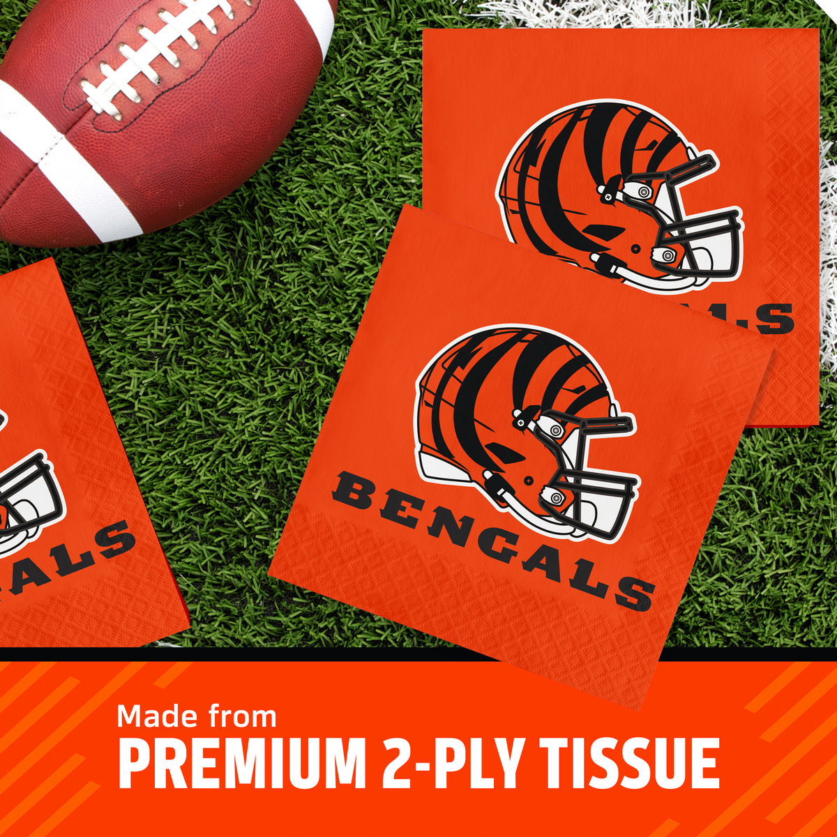 Three Cincinnati Bengals themed square napkins on a green turf background next to a football, with a text banner at the bottom reading 'Made from PREMIUM 2-PLY TISSUE'.
