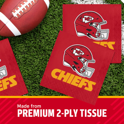 Three Kansas City Chiefs themed square napkins on a green turf background next to a football, with a text banner at the bottom reading 'Made from PREMIUM 2-PLY TISSUE'.