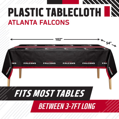 Atlanta Falcons themed plastic tablecloth shown on a table, with dimension arrows indicating 102 inches by 54 inches. Text at top reads 'PLASTIC TABLECLOTH ATLANTA FALCONS' and bottom banner says 'FITS MOST TABLES BETWEEN 3-7FT LONG'.