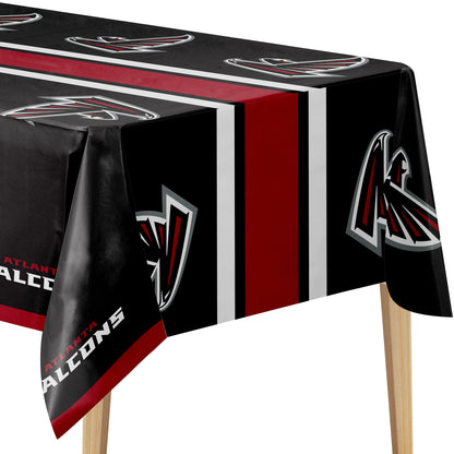 Atlanta Falcons themed tablecloth draped over a table, featuring the team logo, team name, and red, white, and black color scheme.