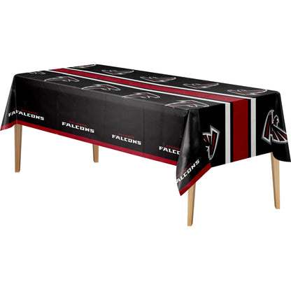 Atlanta Falcons team-themed rectangular tablecloth draped over a table with wooden legs, featuring the team logo and 'FALCONS' text on a black background with red and white stripes.