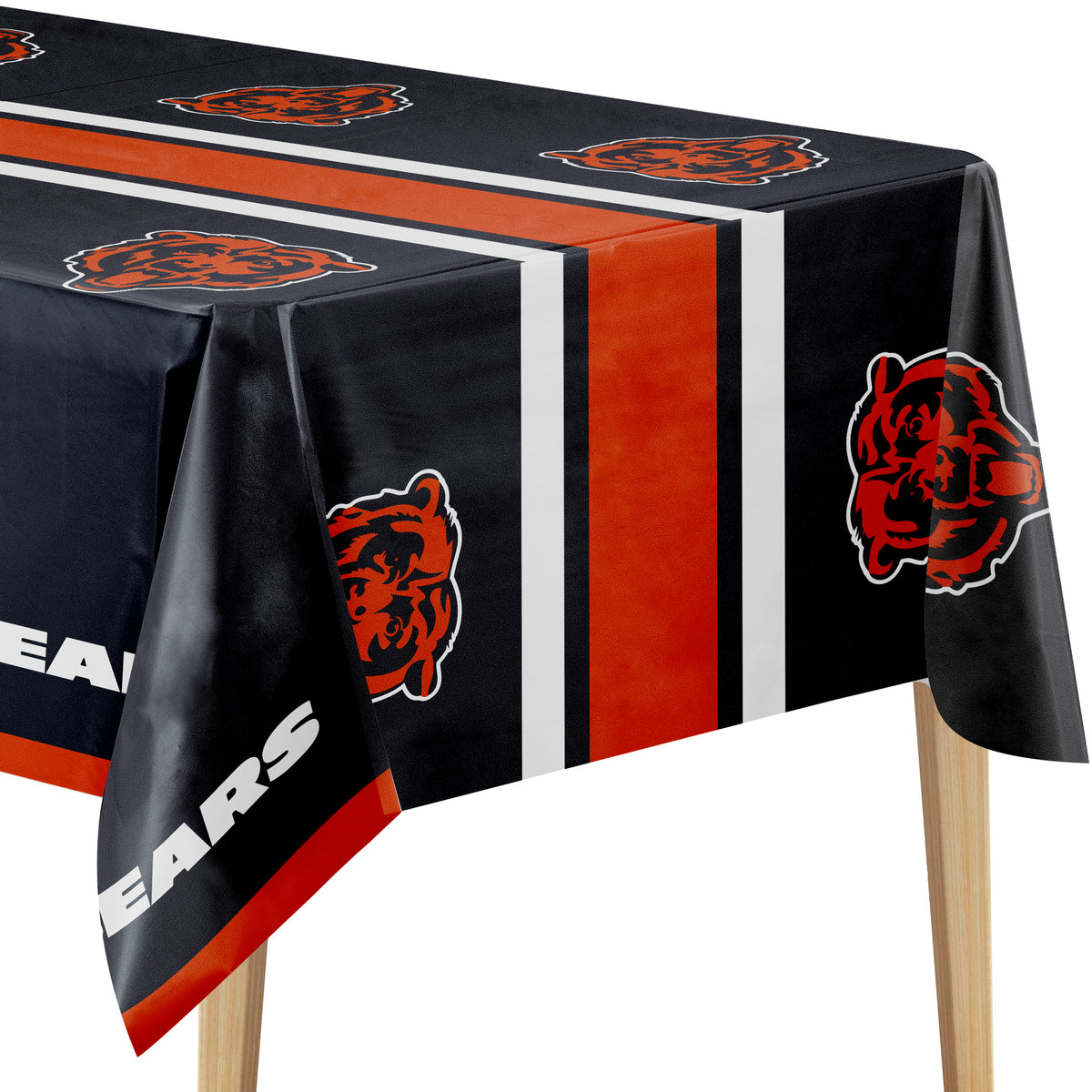 Close-up image of Chicago Bears tablecloth with navy background, orange Bears logo, and "BEARS" text on a wooden table.