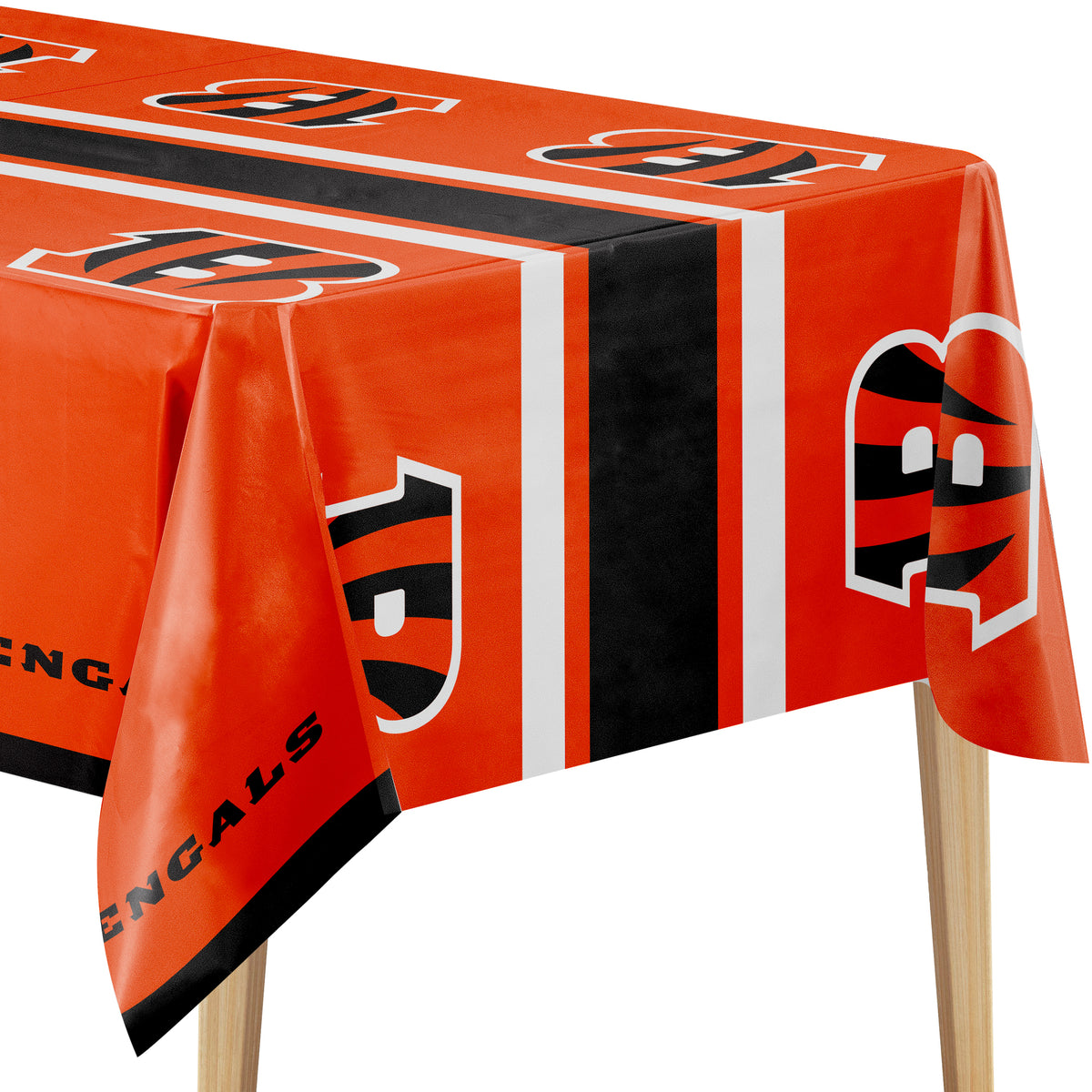 Close-up image of Cincinnati Bengals tablecloth with orange background, "B" logo, and "BENGALS" text on a wooden table.